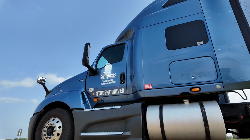 Rear view of the blue student-driver tractor cab in the yard