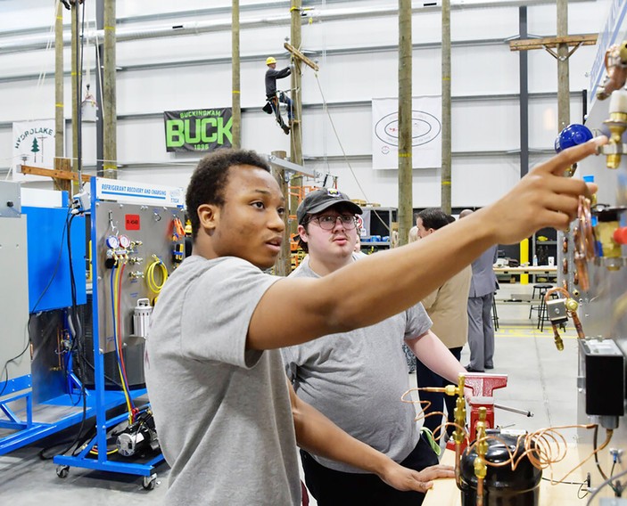 Students training on hands-on utility equipment at the ATC