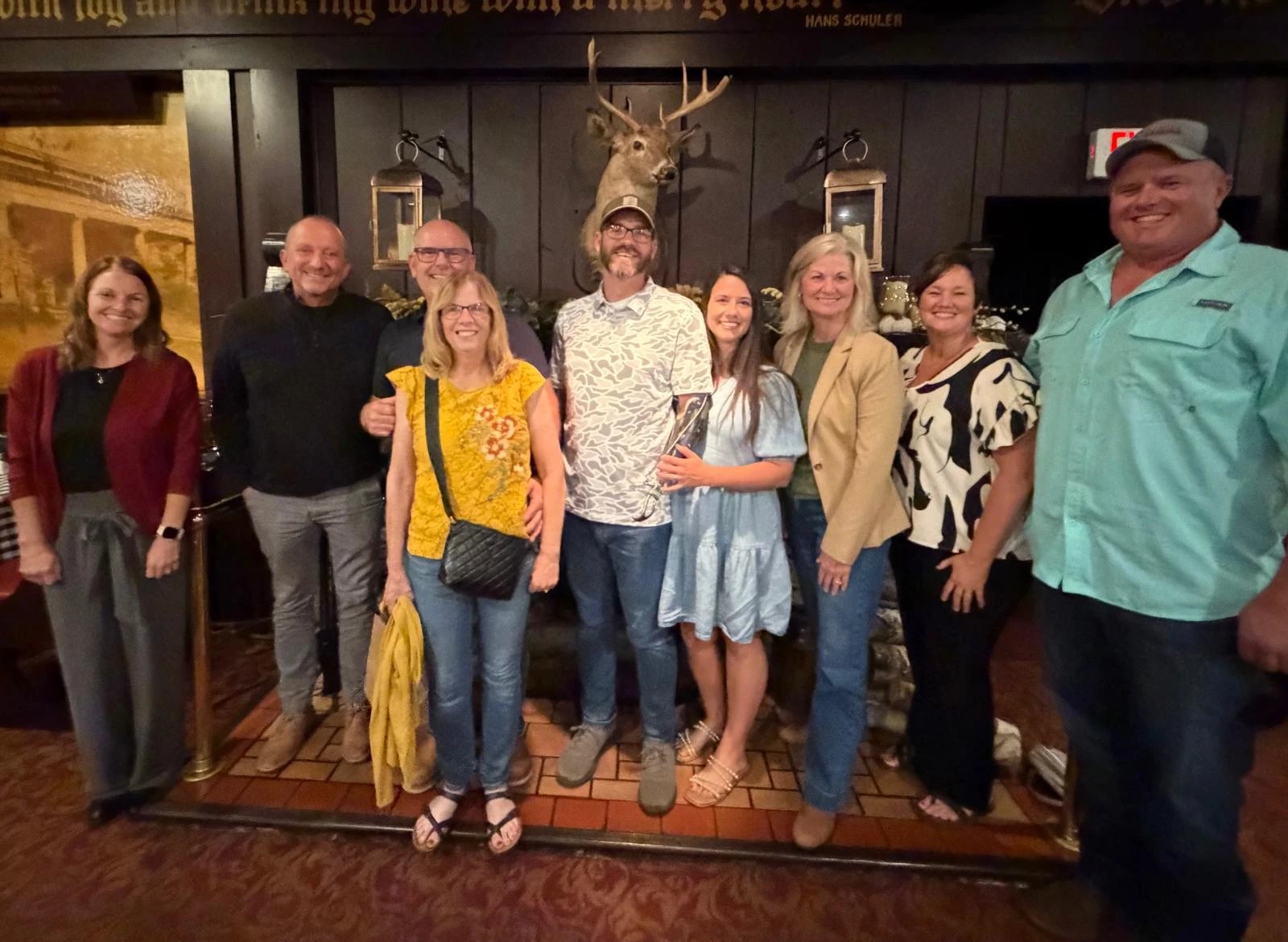 Alpha Omega Safety Solutions and SPE Group leadership standing with Branden Bauer and his wife Katelyn